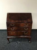 A reproduction mahogany bureau