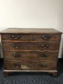 A Georgian mahogany five drawer chest on bracket feet