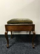 A mahogany piano stool