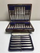 A cased set of twenty-four silver plate and mother of pearl cake knives and forks,
