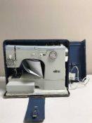 An Elna sewing machine and one other