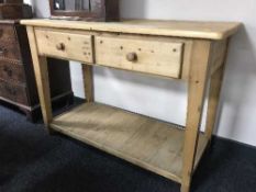 A pine two drawer serving table