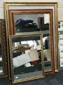 A monochrome print in gilt frame and two mirrors