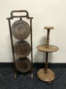 A mahogany three tier cake stand and smoker's stand