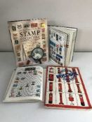 Four albums of stamps