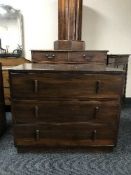 A 1920's stained beech wood three drawer chest