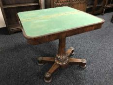 An early Victorian rosewood card table on pedestal support