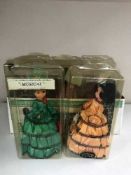 A box of Mayfair dolls in cases