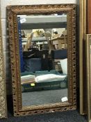 An ornate gilt framed mirror
