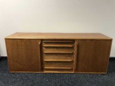 A teak low sideboard fitted with drawers