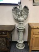A pair of garden eagles on columns