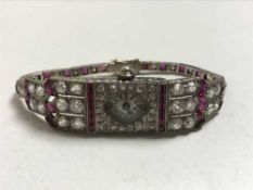 A superb quality ruby and diamond cocktail watch in platinum case, approximately 6cts of diamonds.