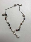 A freshwater brown/white pearl necklace
