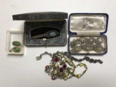 Three silver bracelets, a turquoise set brooch, two necklaces and a pair of rolled gold earrings.