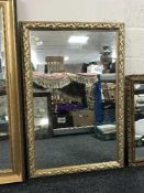 An ornate gilt framed mirror