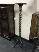 A mahogany torchere on spiral support