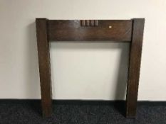 An early 20th century oak fire surround