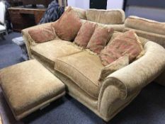 A contempotary four piece lounge suite comprising of three seater settee, two seater,