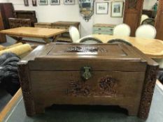 A Chinese carved camphorwood chest.
