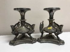 A pair of sliver plated Egyptian Revival candle stands
