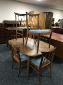 A mid 20th century teak G-Plan dining table and six chairs