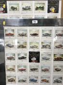 Two framed panels depciting vintage racing cars