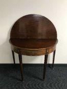 A Georgian inlaid mahogany d-shaped tea table