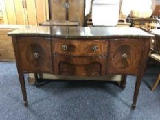 A Regency style serpentine front sideboard