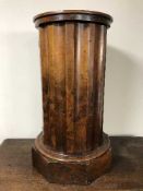 A walnut pedestal pot cupboard