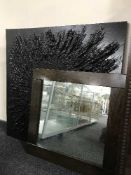 A wooden framed mirror and two contemporary abstract pictures