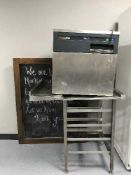 A Whirlpool K20 on stainless steel stand and a chalk board