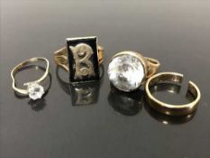 A Gentleman's ring set with a clear stone, together with a yellow metal wedding band,