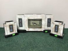 A three piece Art Deco gilt metal clock garniture