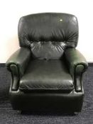 Two green leather armchairs