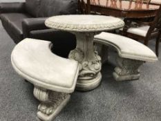 A garden circular table on pedestal together with pair of curved benches