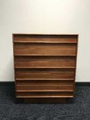 A teak five drawer chest