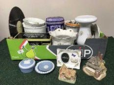 A box of Ringtons ware tins, cottages,