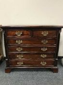 A Georgian style six drawer mahogany chest with ebonised columns