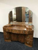 A walnut three piece bedroom suite