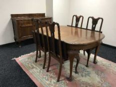 A late Victorian mahogany extending dining table and four mahogany chairs
