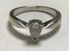 An 18ct white gold pear cut diamond ring