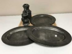 A tray of antique pewter chargers,