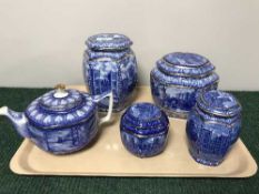 A tray of Ringtons blue and white caddies and a teapot
