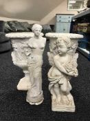 A pair of classical style garden urns,