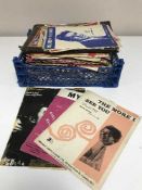 A box of LP records and sheet music