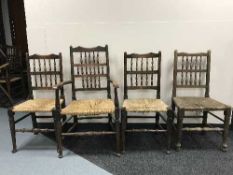 A set of nine antique oak rush seated country chairs