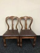 A pair of Victorian dining chairs