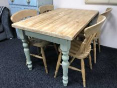 An antique style painted kitchen table and four pine chairs