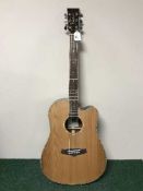 A Tanglewood Discovery semi acoustic guitar in box with retail price ticket of £429