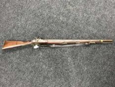 A 19th century percussion cap musket, the lockplate stamped Tower, the 84cm barrel with proof marks,